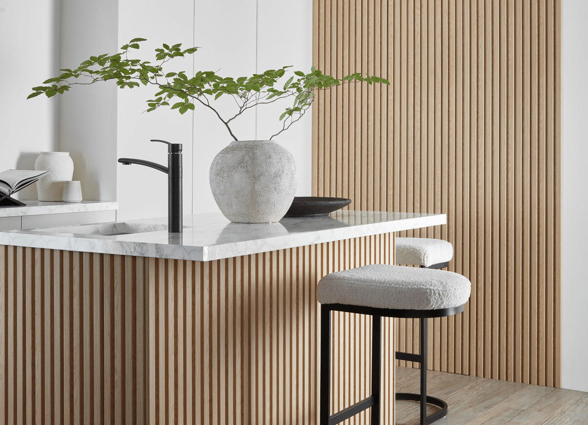 SlatWall waterproof natural oak panels around kitchen breakfast bar and in background on the wall